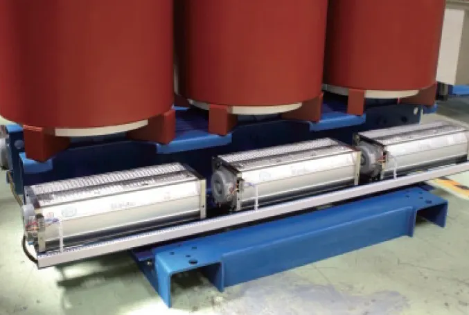 Cross-flow cooling fans under the windings